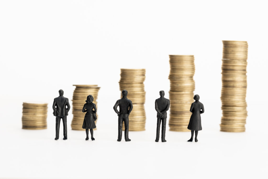 Group of figurines looking at growing stacks
